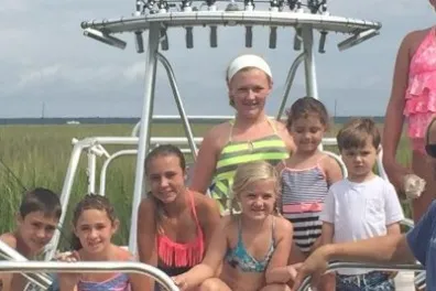 Family tour on a boat exploring the marshlands