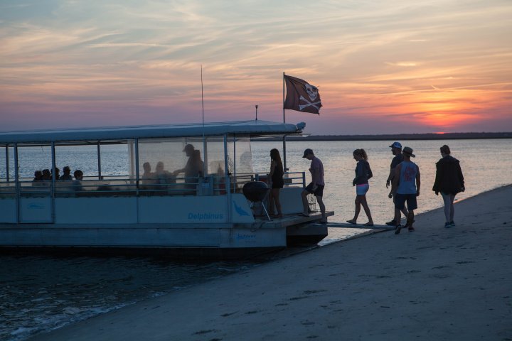 Large pontoon boat onshore on beach