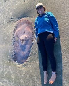 a person laying next to Lion's mane jelly on Capers!