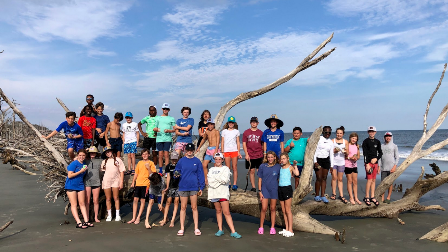 a group of people on a beach