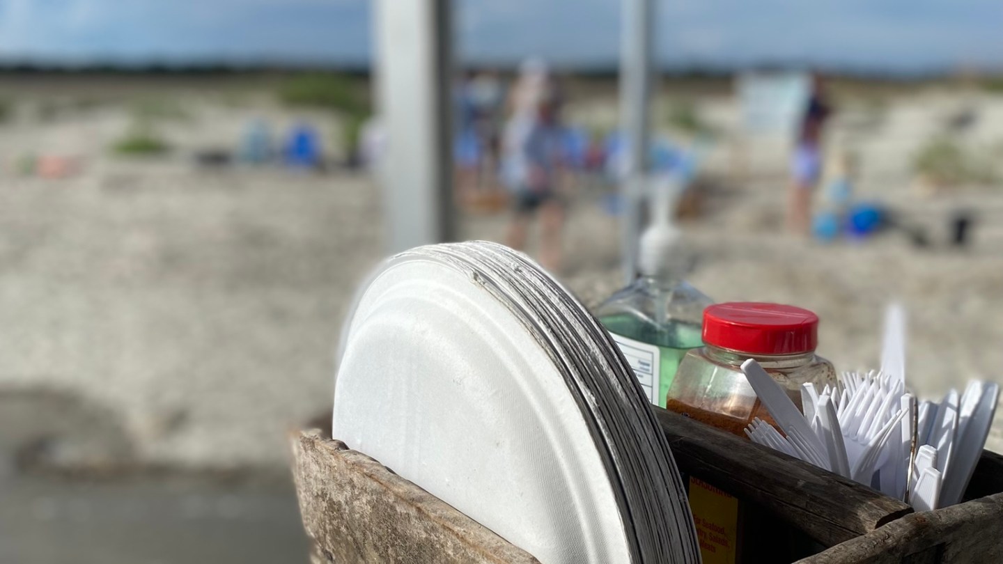 a boat sitting on top of a beach