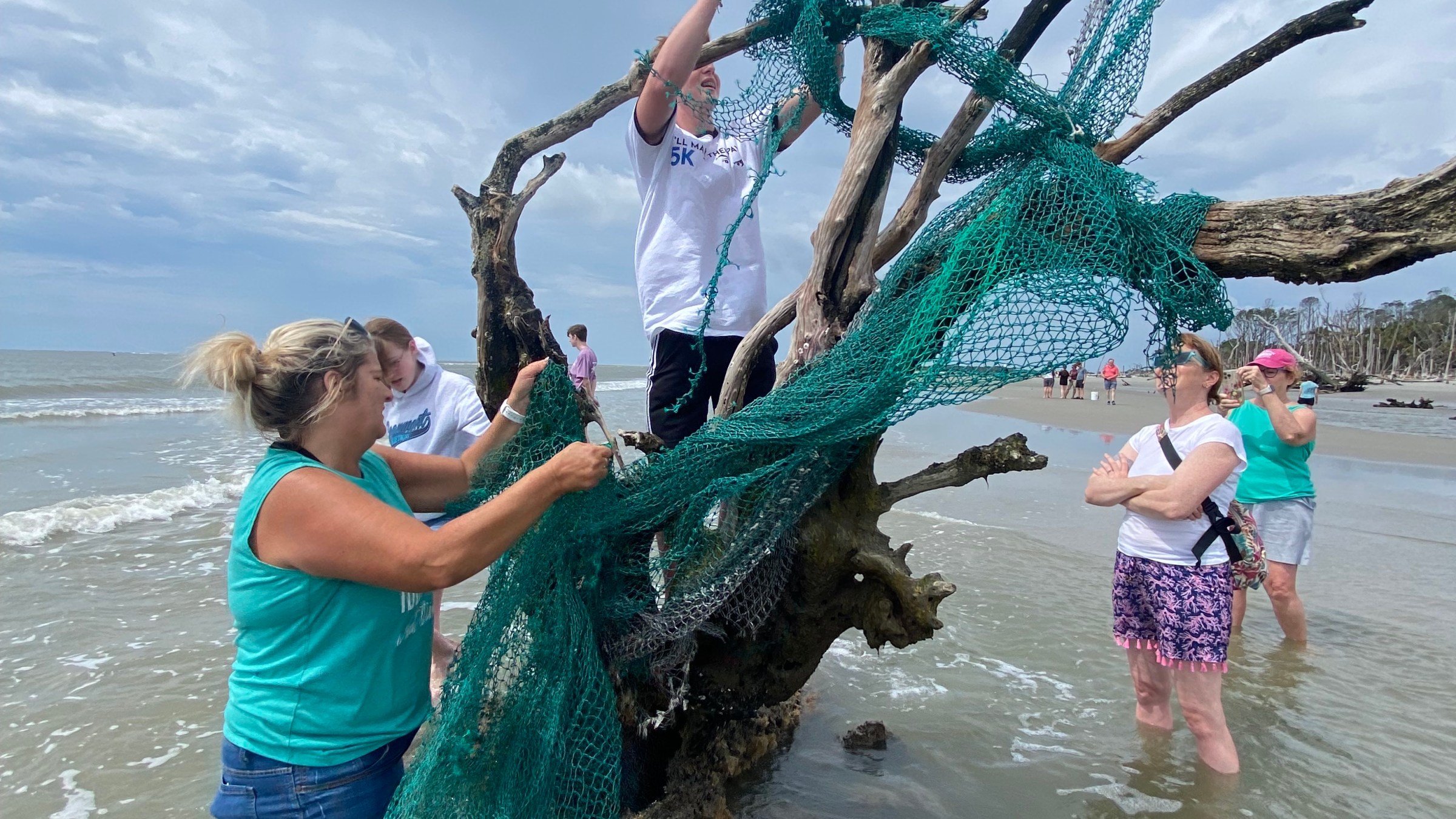 a woman jumping into the water