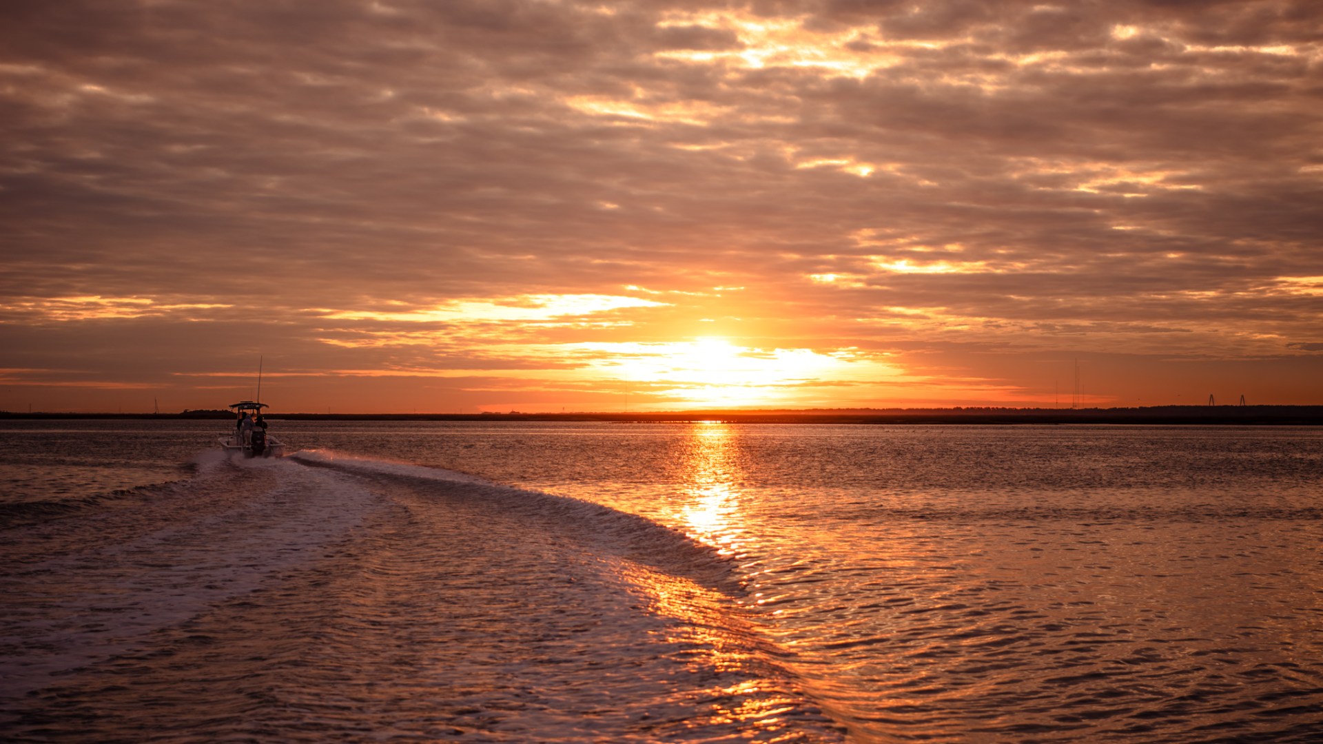 a sunset over a body of water