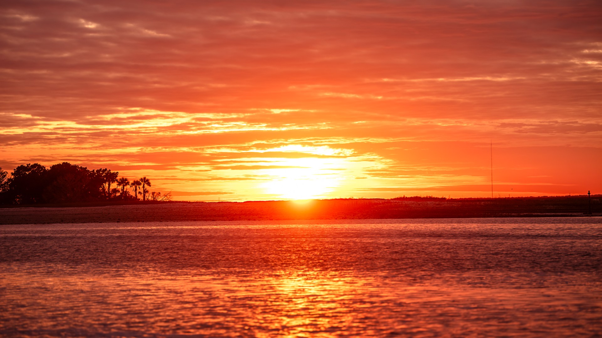 a sunset over a body of water