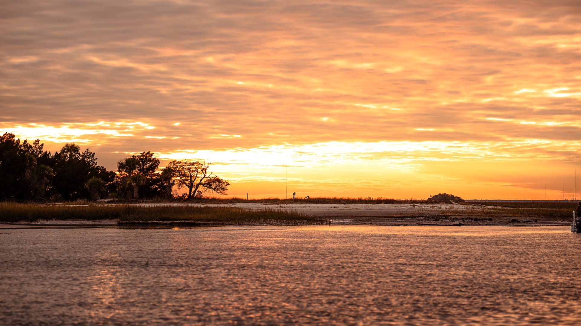 a sunset over a body of water