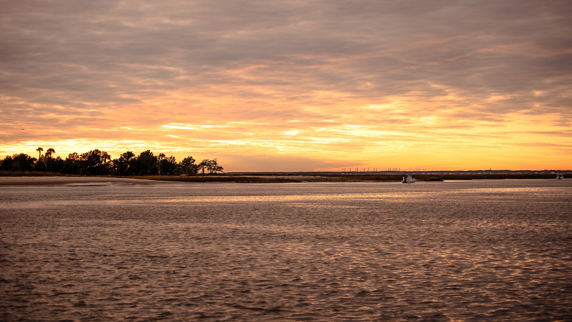a sunset over a body of water