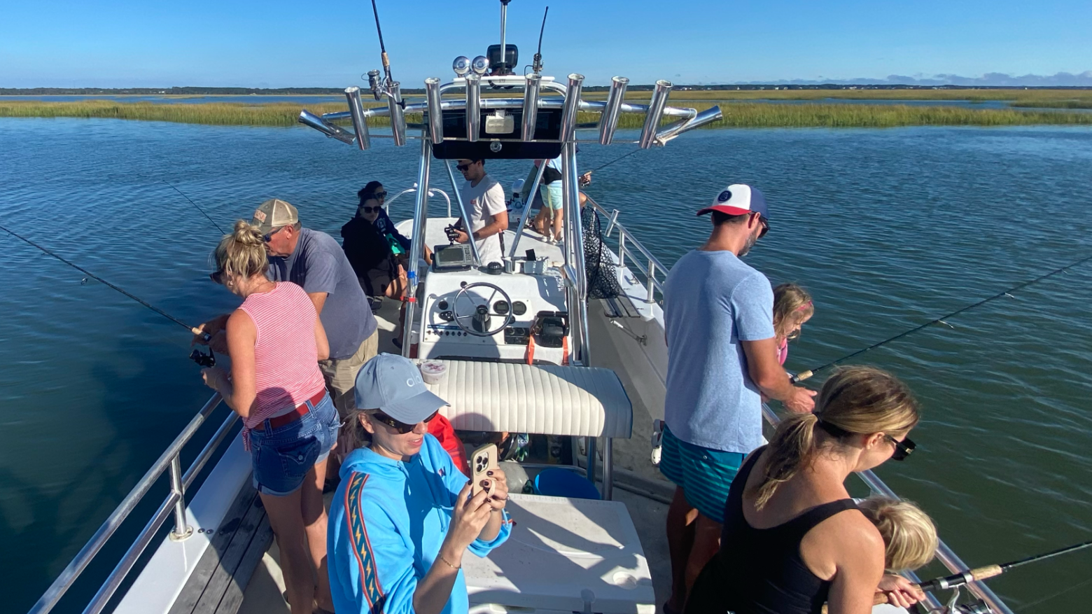 a group of people in a boat on a body of water