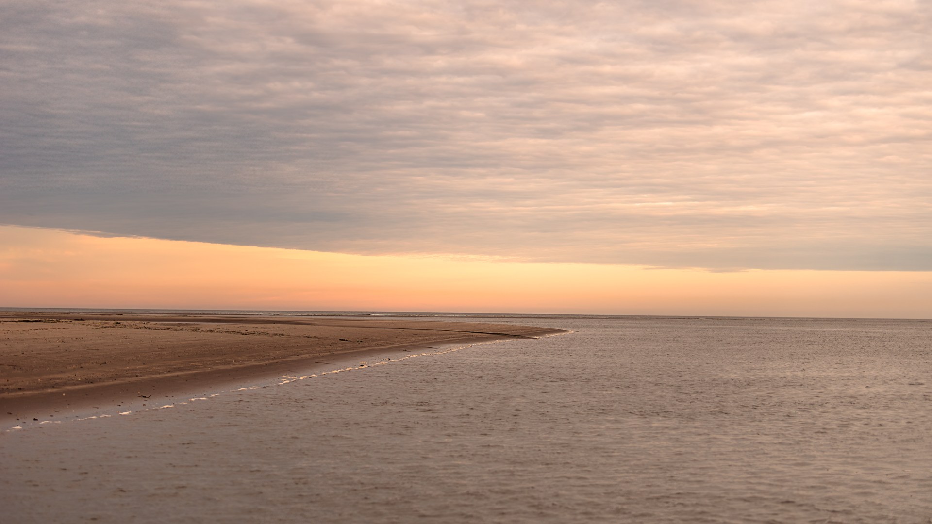 a sunset over a beach
