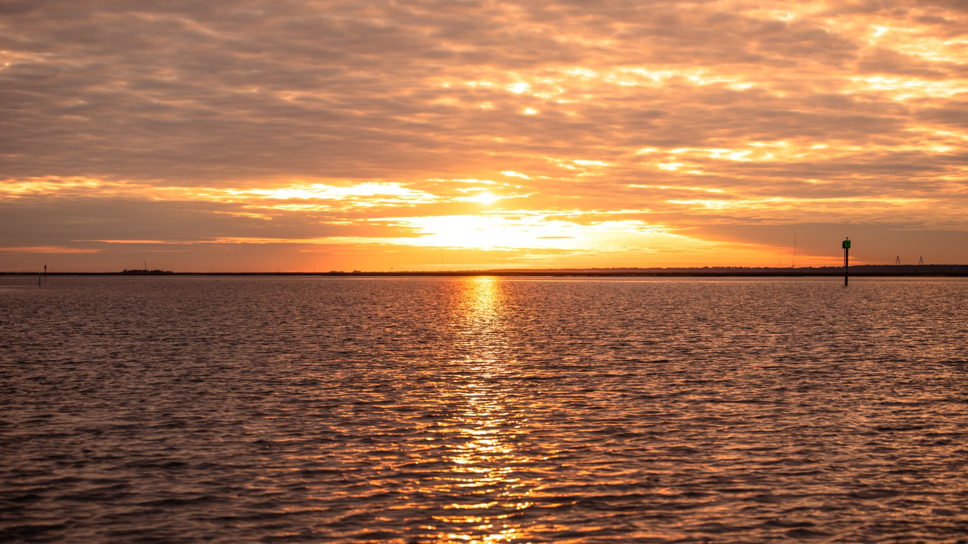 a sunset over a body of water