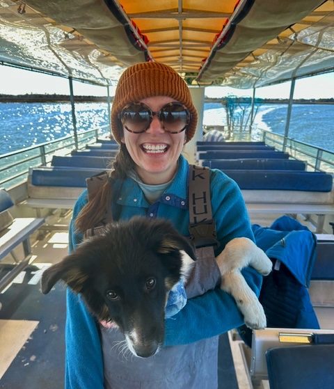 a dog sitting on a boat