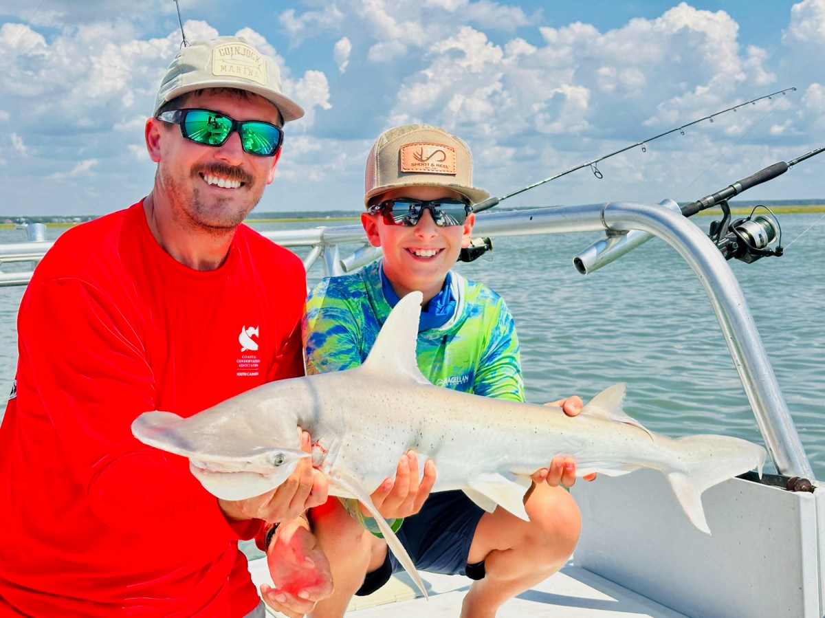 a person holding a fish